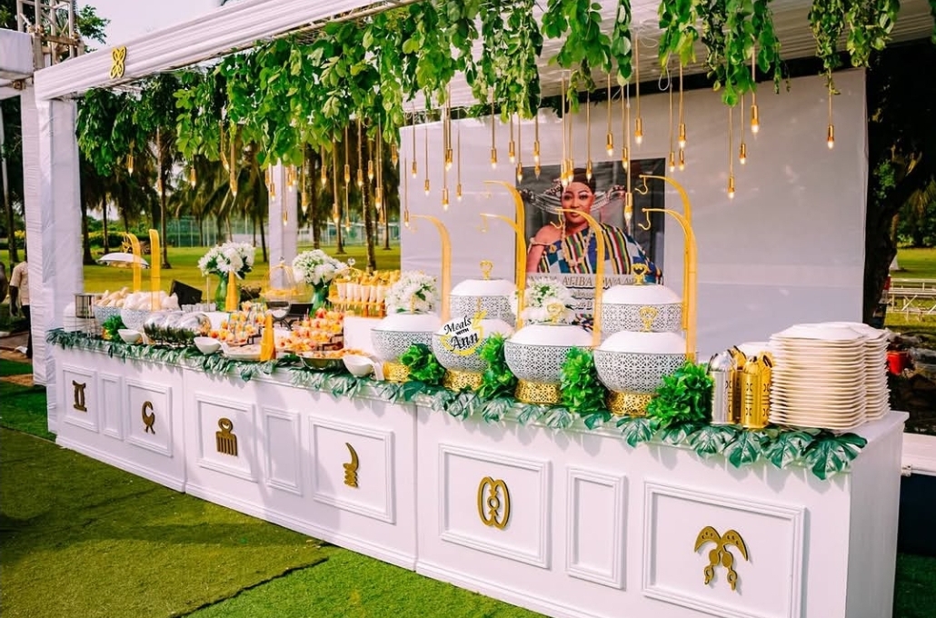 Luxury Adinkra-themed buffet setup with gold accents