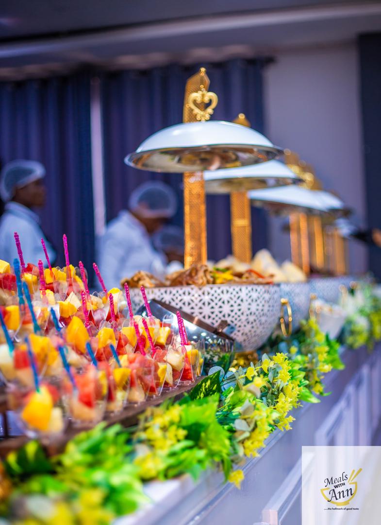 Grand buffet setup with gold chafing dishes